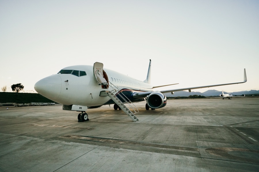 Boeing Business Jet boarding at dusk
